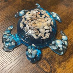 Blue sea turtle with sea shells