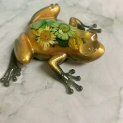 Green Gold frog with flowers
